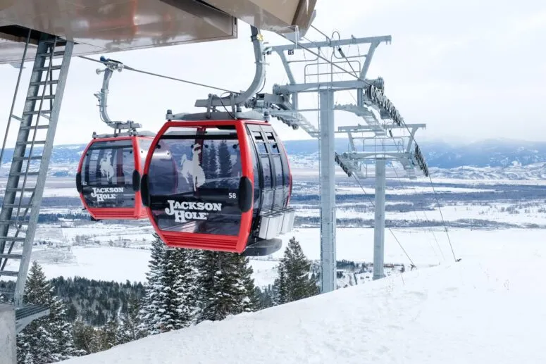 Skier on a snowy slope at Jackson Hole, Wyoming with mountains in background