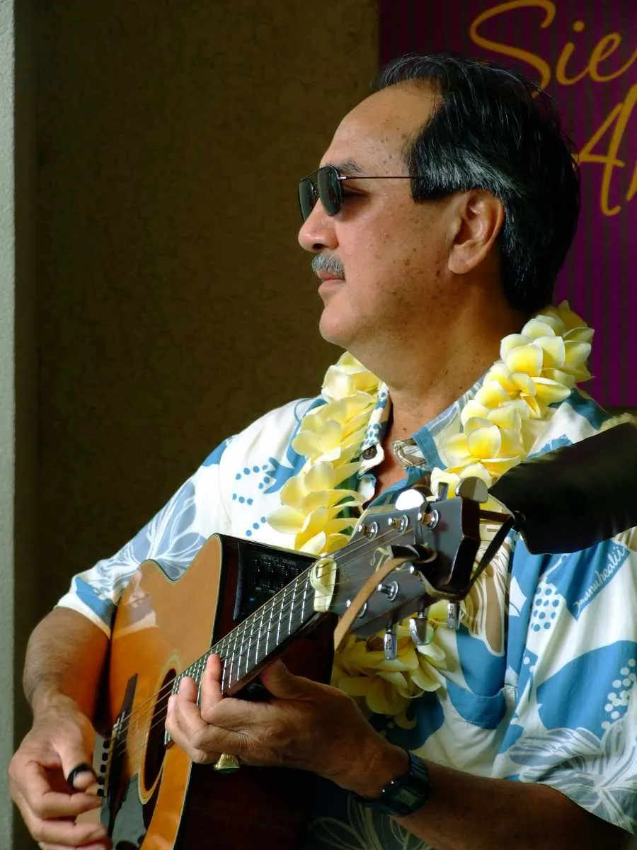 Slack key guitarists performing on stage
