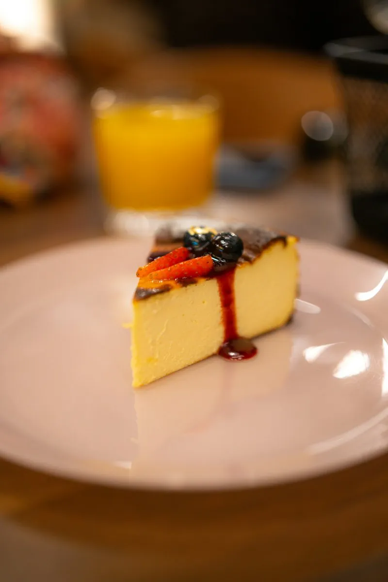 Slice of rich New York style cheesecake, known for its dense texture