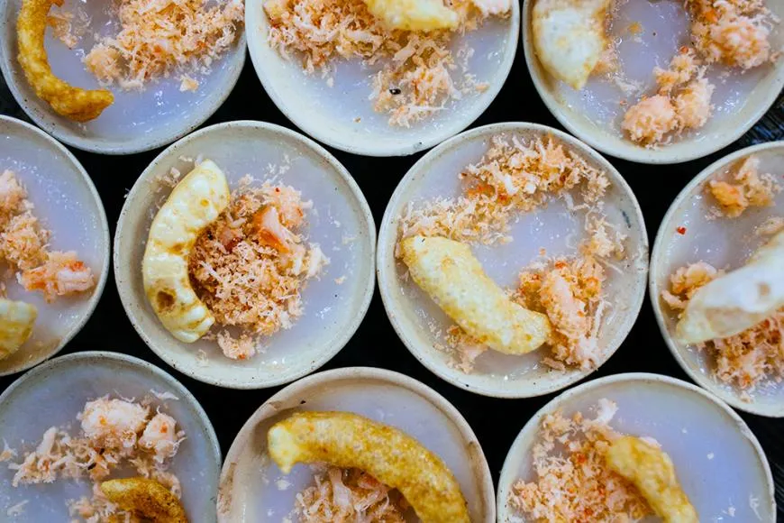 Small steamed rice cakes topped with shrimp and pork cracklings, Banh Beo from Hue