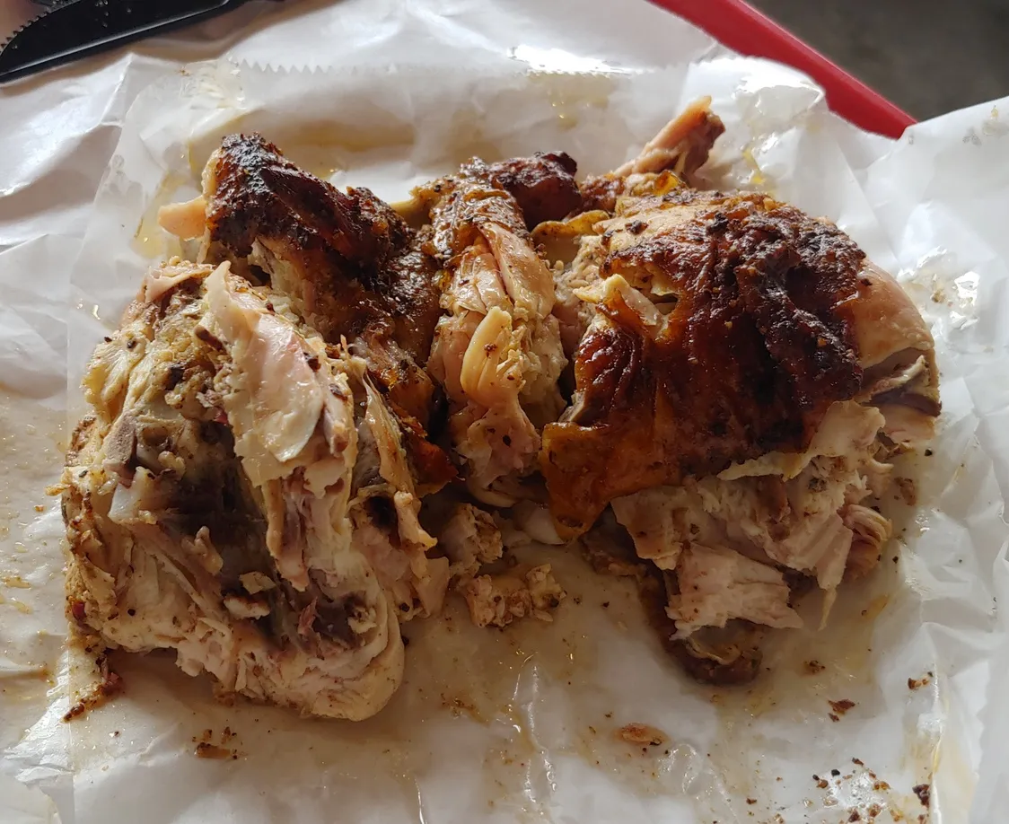 Smoked chicken at Rudy's BBQ, noted for its tender and smoky flavor, a great choice for what to eat in san antonio texas