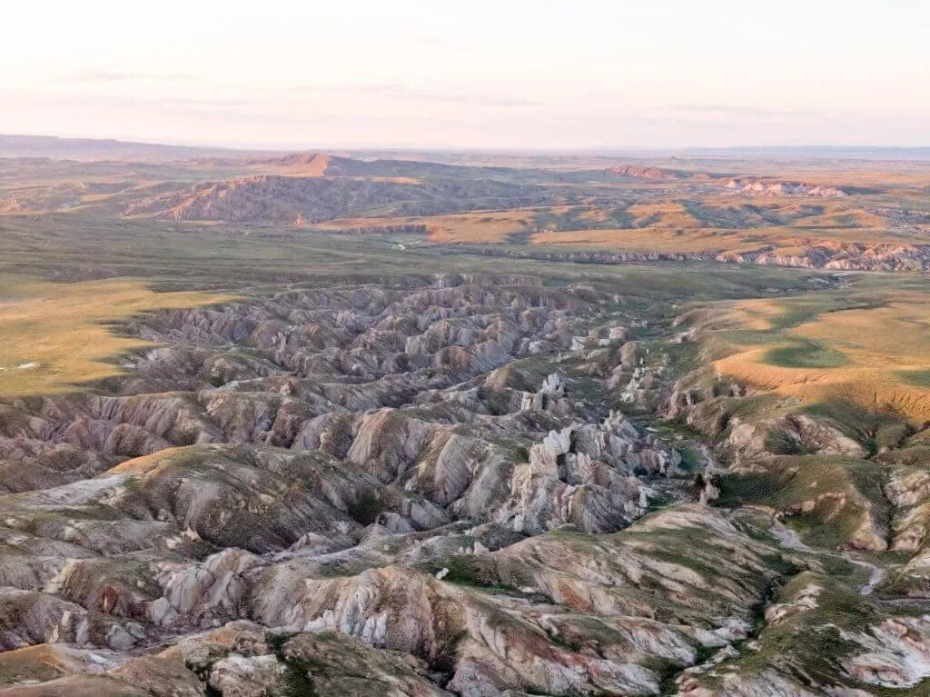 Sprawling rocky landscape of Hell's Half Acre geological formation - Things To See And Do In Wyoming Geology