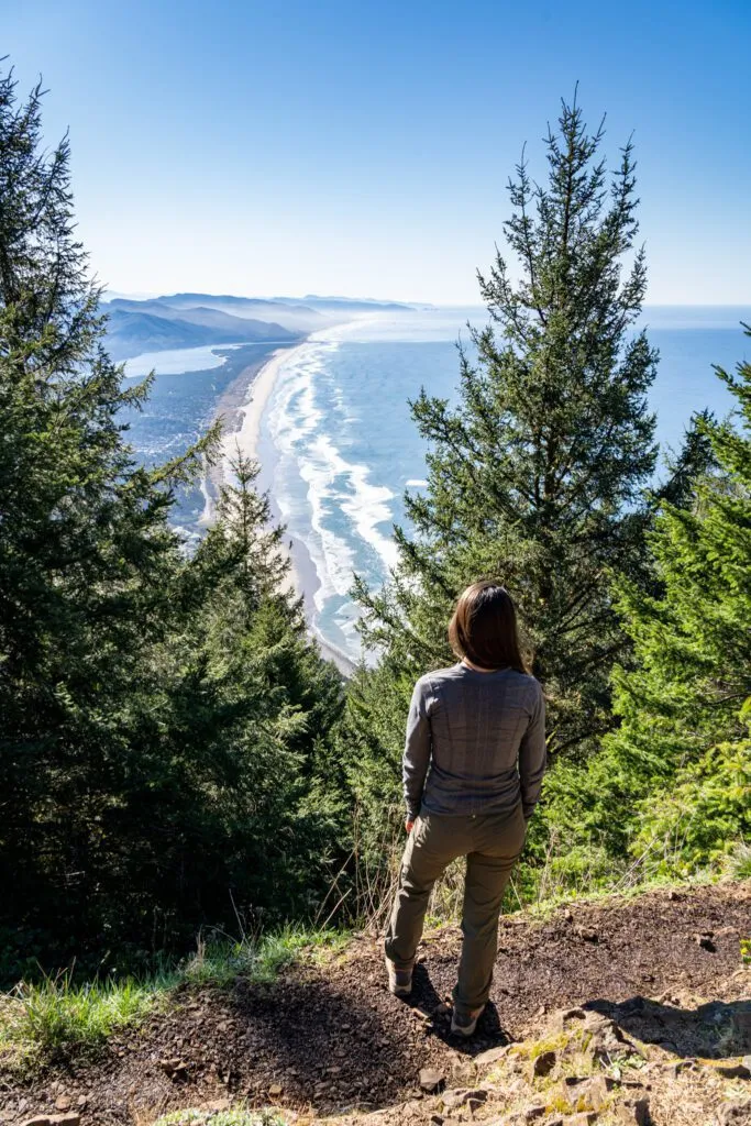 Standing at the summit of Neahkahnie Mountain with views down the southern coastline