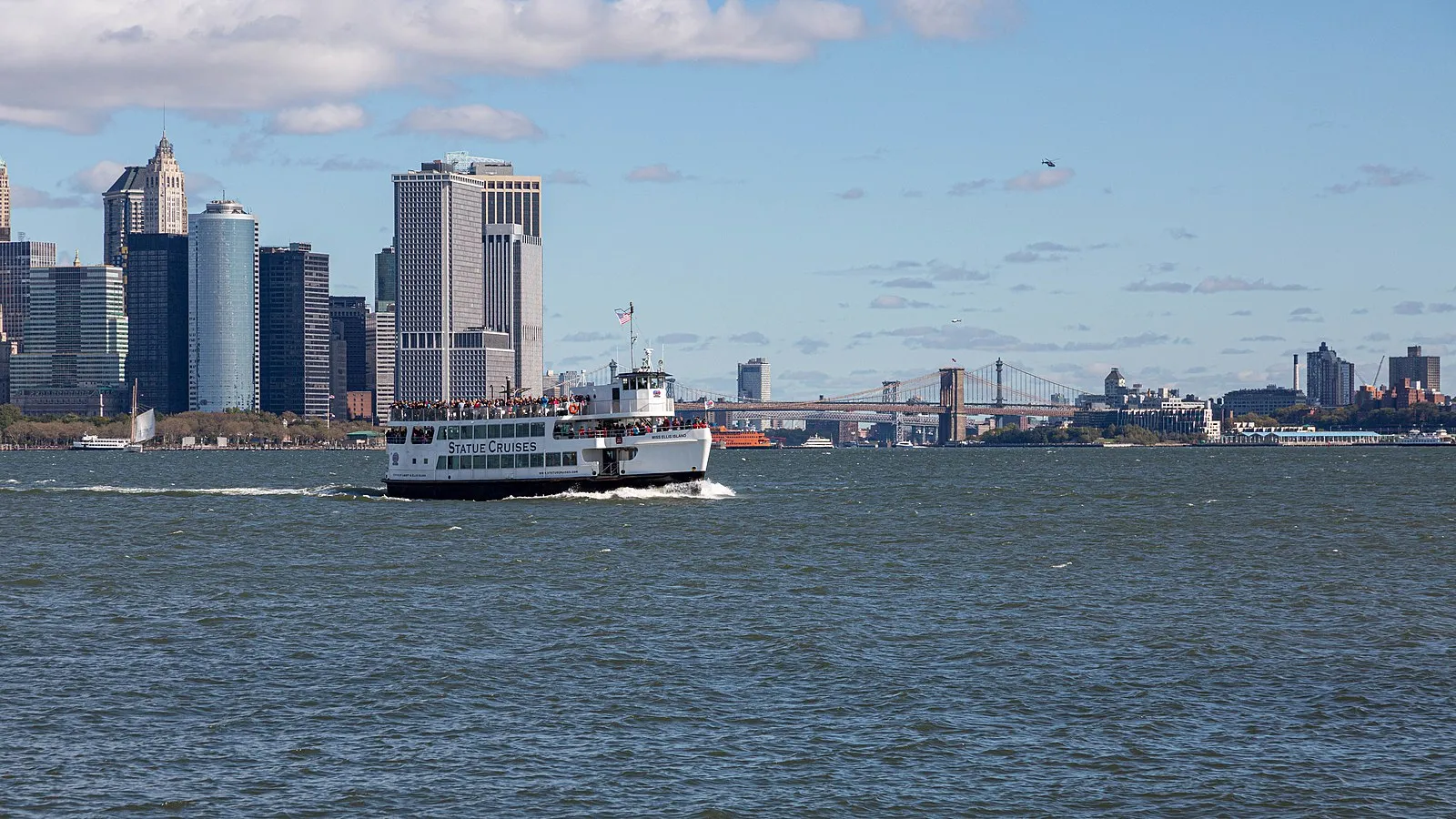 Statue Cruises ferry sailing towards the Statue of Liberty
