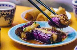 Steaming baskets of assorted dim sum, representing the diverse Chinese foods associated with New York's Chinatowns