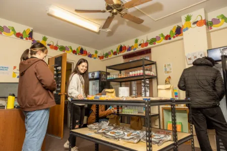 Students selecting items at a Wyoming Food Share Pantry on campus