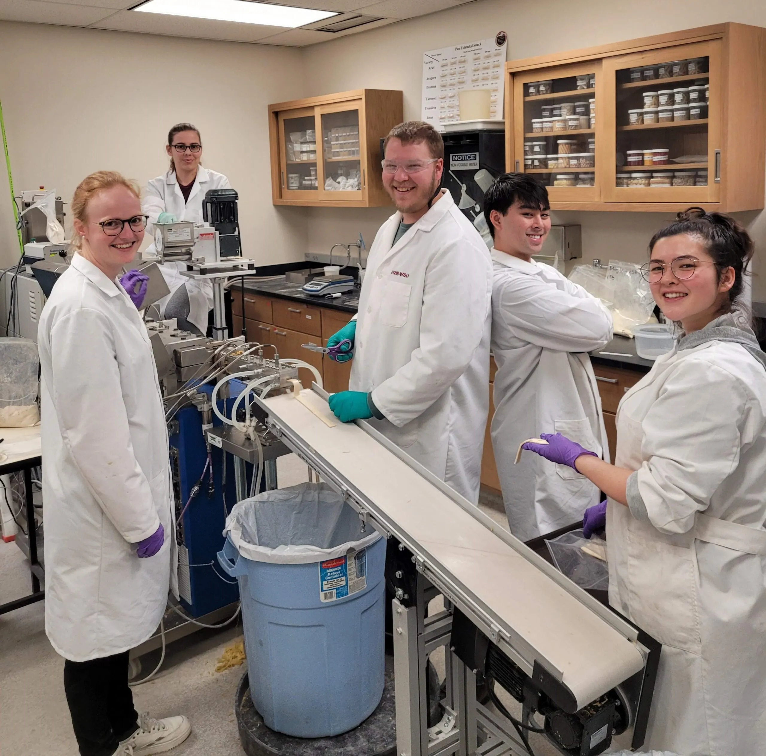 Students working in a lab setting at Washington State University Culinary Arts program.