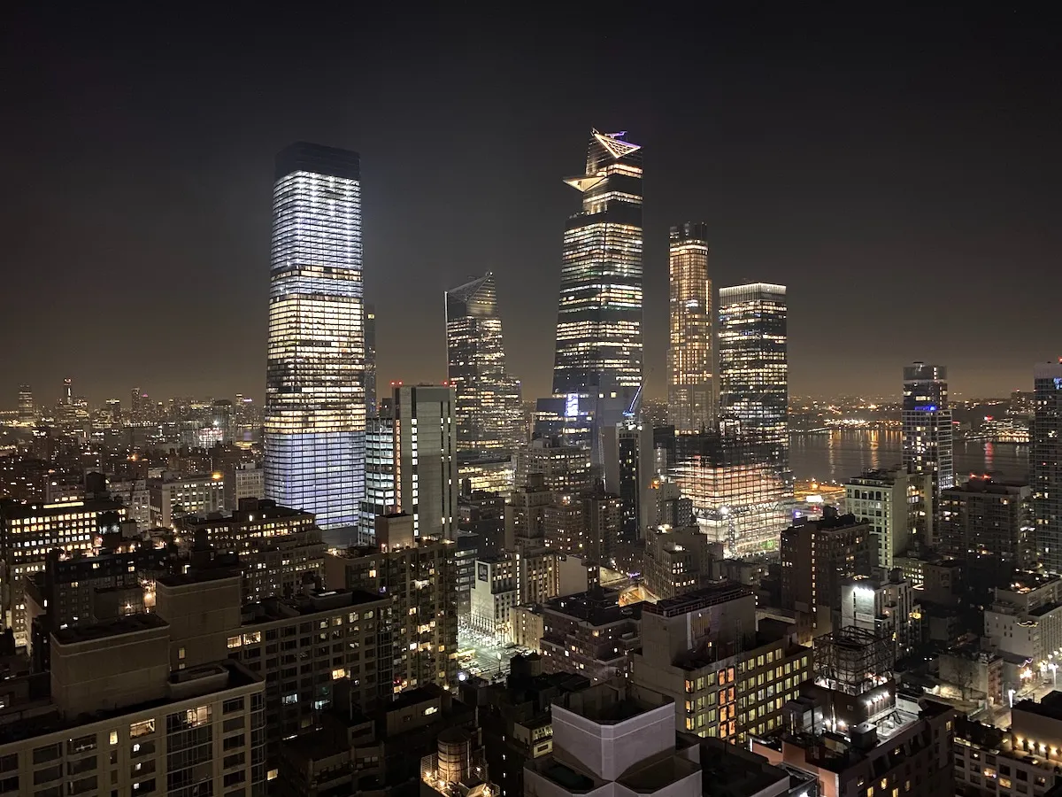 Stunning night view of the Manhattan skyline from a rooftop, an essential part of going out in new york.