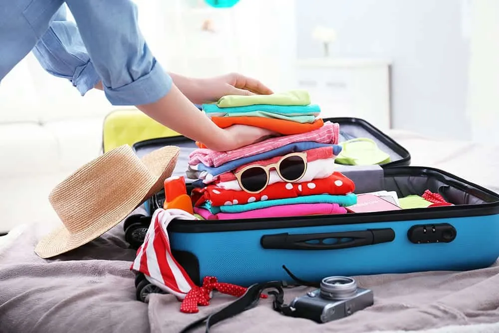 Suitcase packed for a vacation, ready for travel