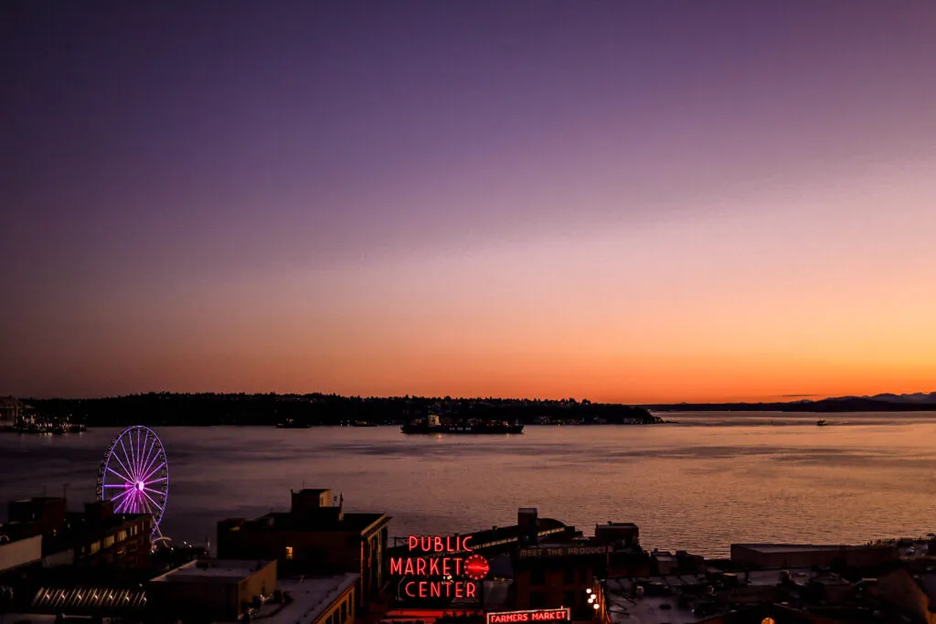 Sunset skies overlooking the Puget Sound with Pike Place market in frame