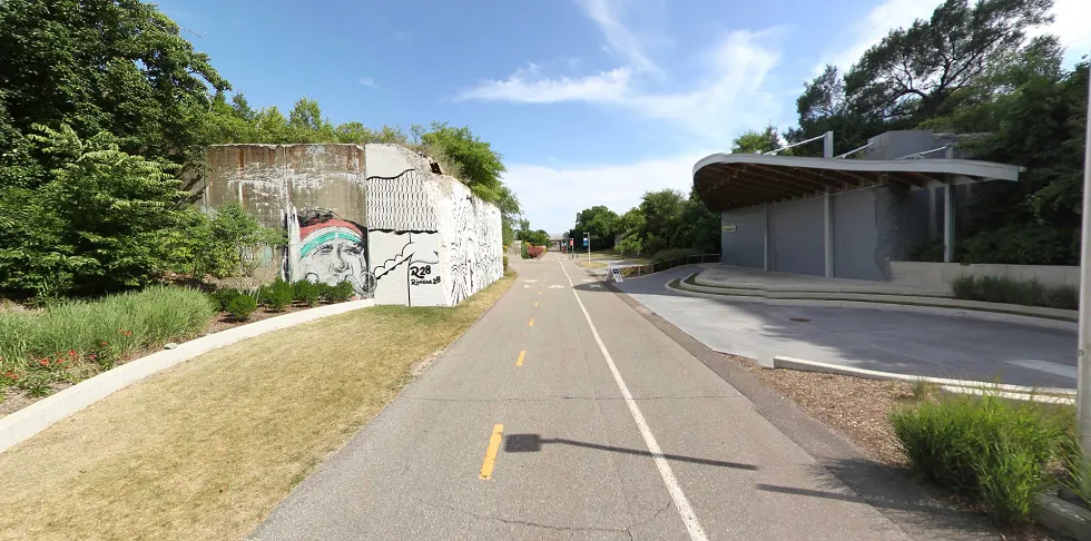 The Dequindre Cut greenway in Detroit, featuring murals and separate lanes for pedestrians and cyclists