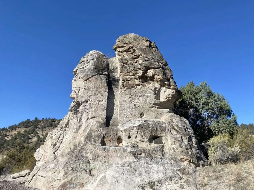 The distinctive Chimney Rock formation with log cabin remnants