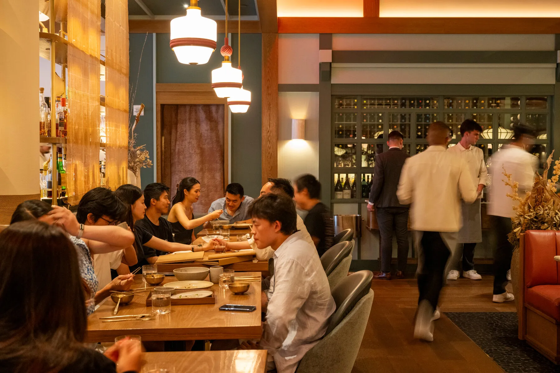 The elegant interior of Oiji Mi, featuring plush seating and sophisticated decor reminiscent of a supper club.