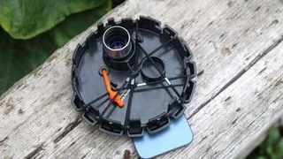 The eyepiece and dust cap together from the Celestron Inspire 100AZ budget amateur astronomy telescope