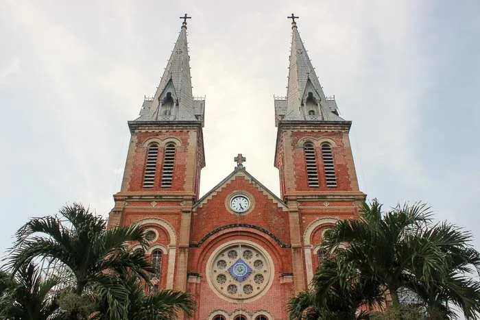 The facade of the Notre-Dame Cathedral Basilica in Saigon, showing its towers and colonial architecture