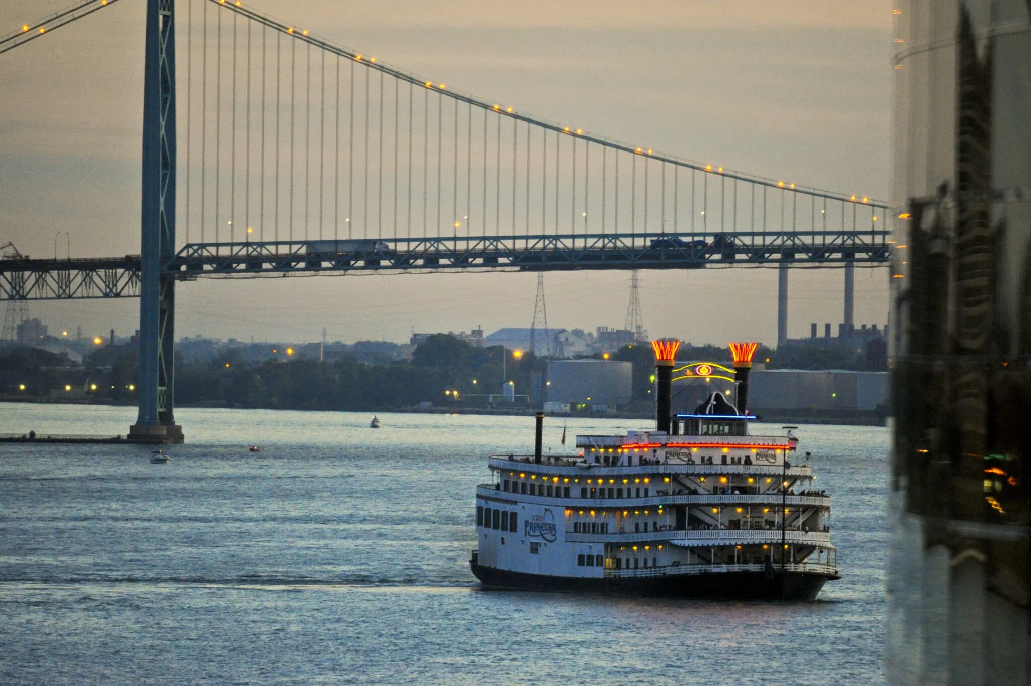 The historic Detroit Princess Riverboat cruising on the Detroit River with city skyline in the background