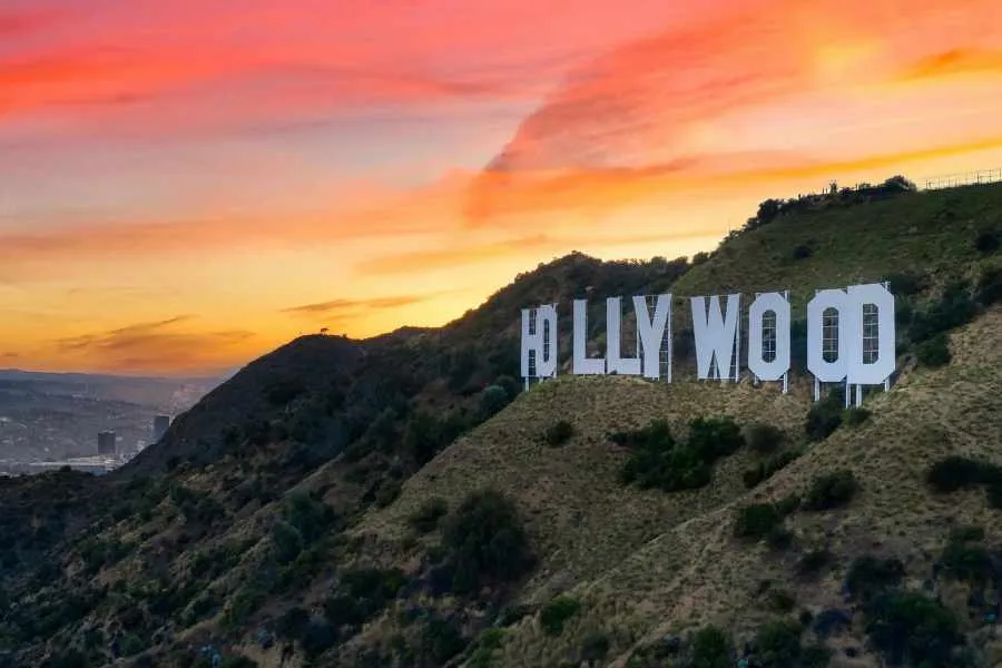The iconic Hollywood sign visible from a distance in Los Angeles.