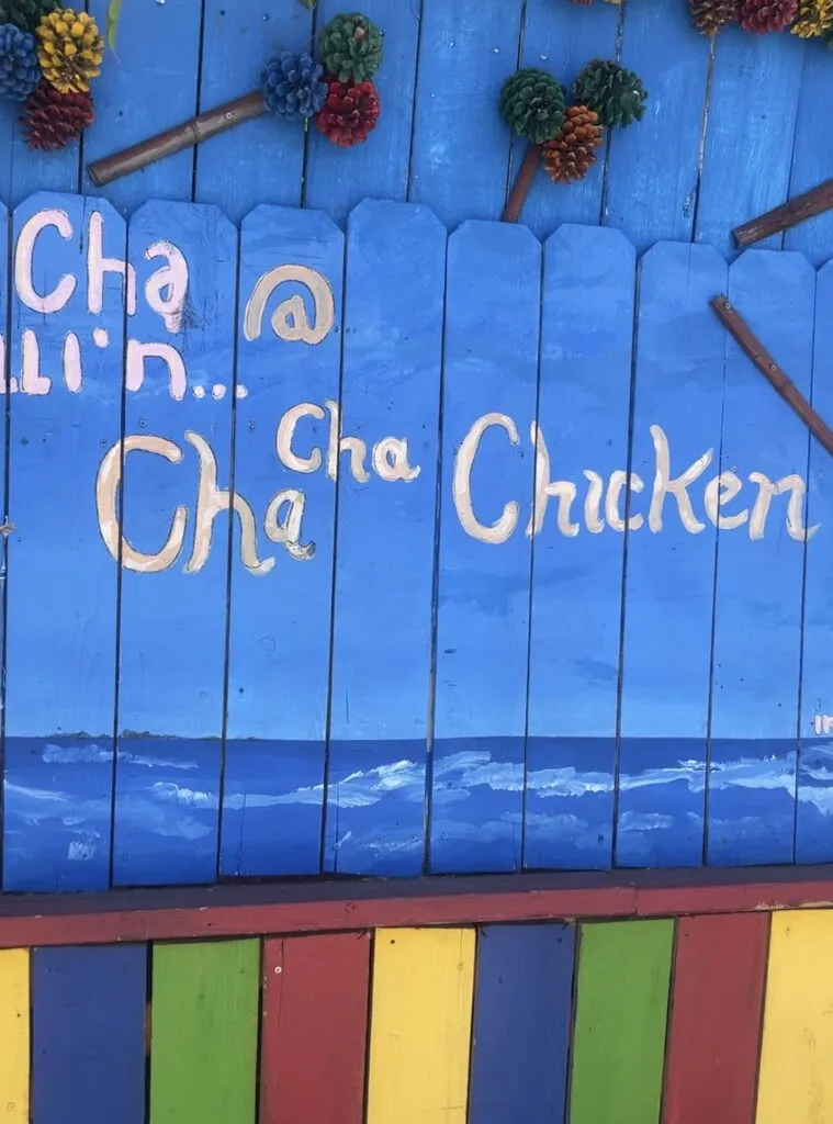 The recognizable &quot;Cha Cha Chicken&quot; sign on the wall