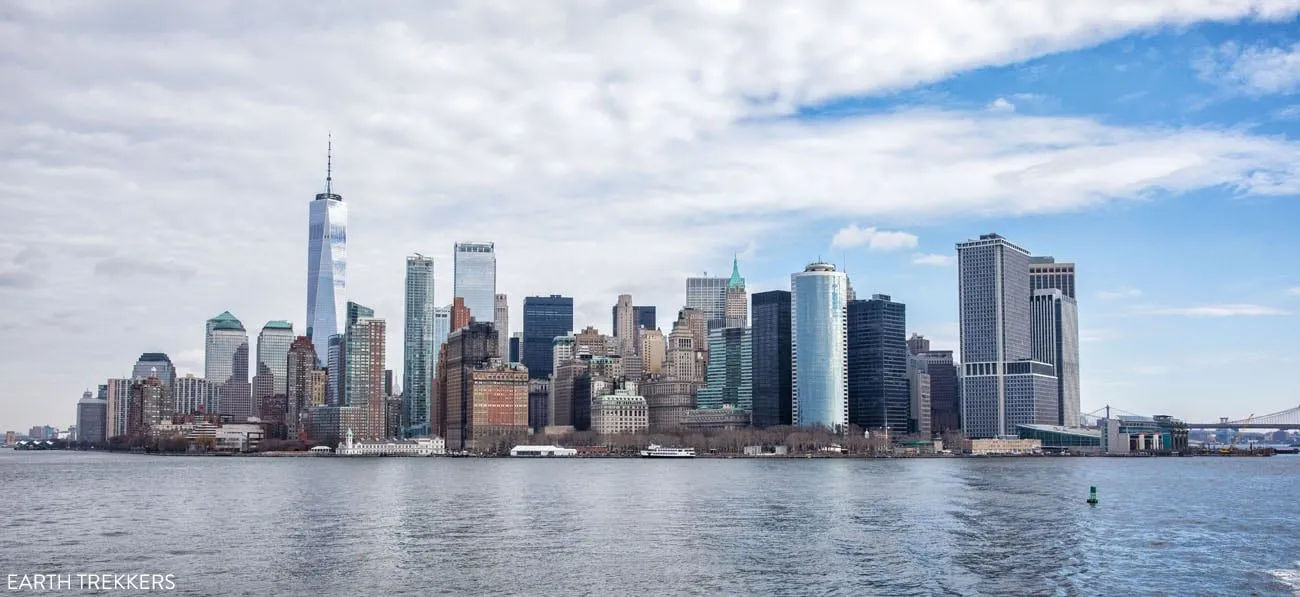 The Staten Island Ferry crossing New York Harbor with the Manhattan skyline in the background