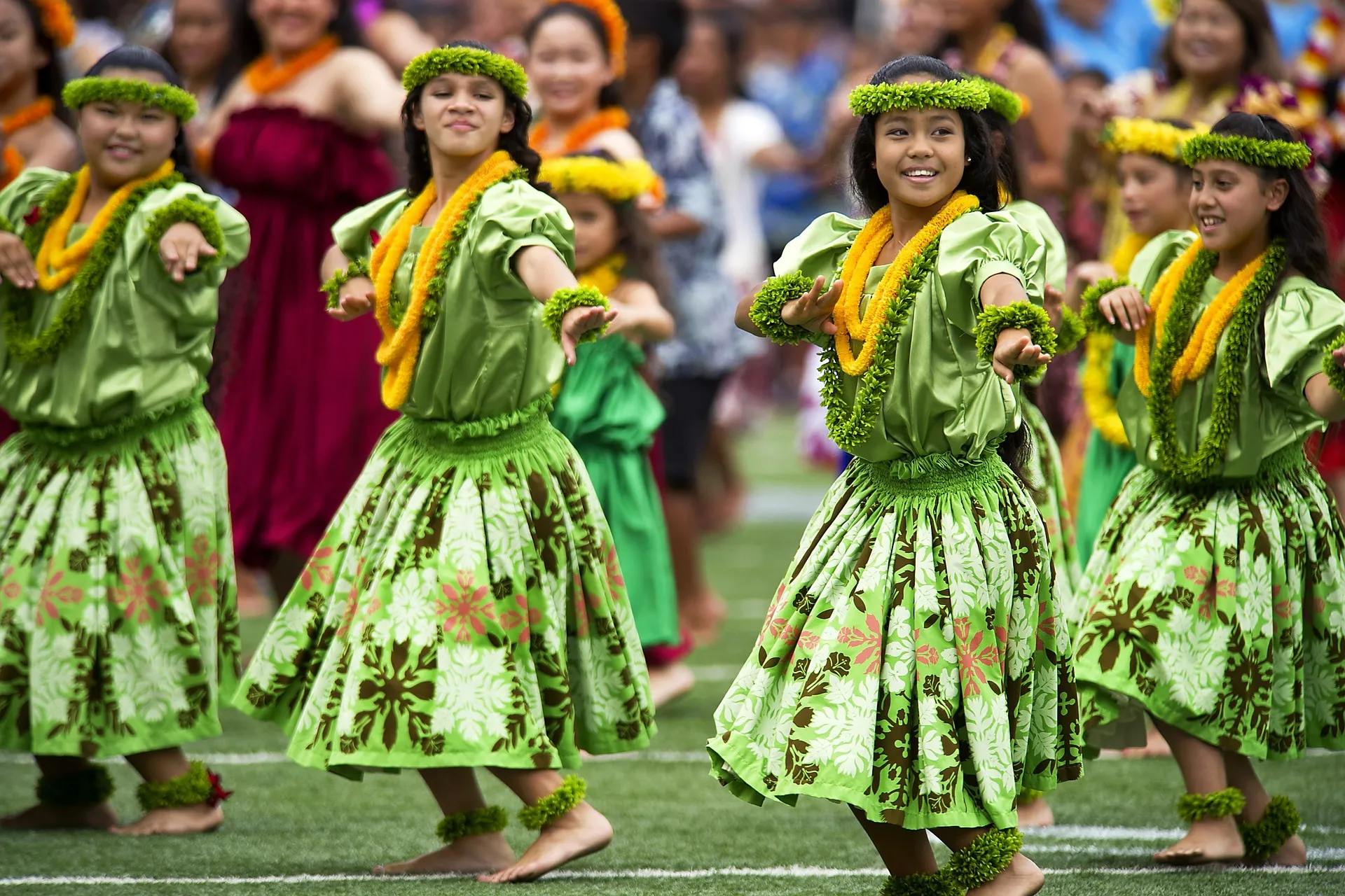 Traditional Hawaiian Hula dancers performing at a Luau near Honolulu