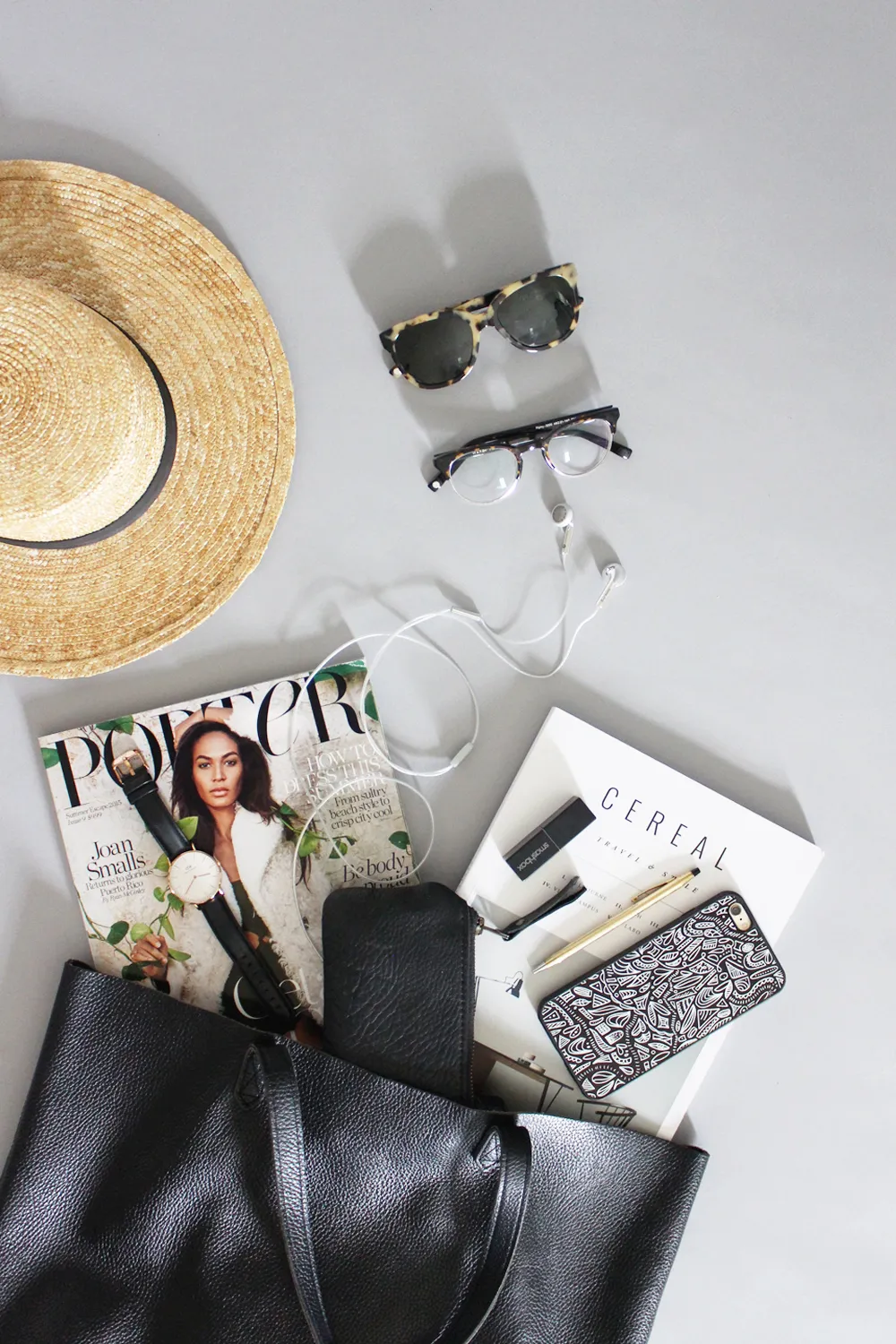 Travel essentials packed in a leather tote bag for a trip