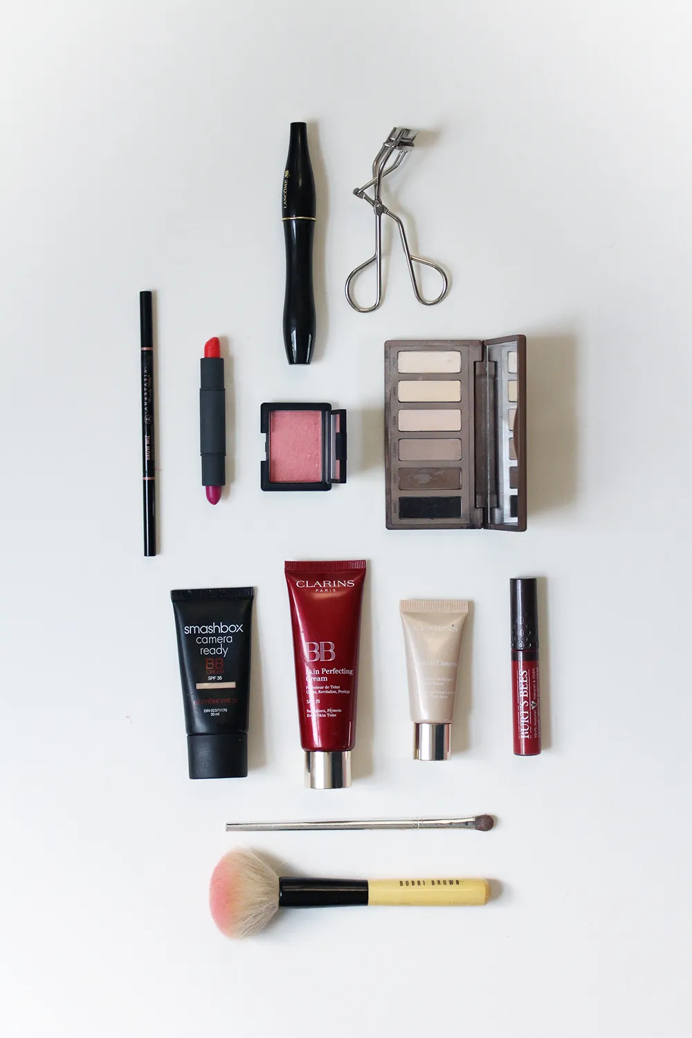 Travel makeup and beauty products packed in a travel case