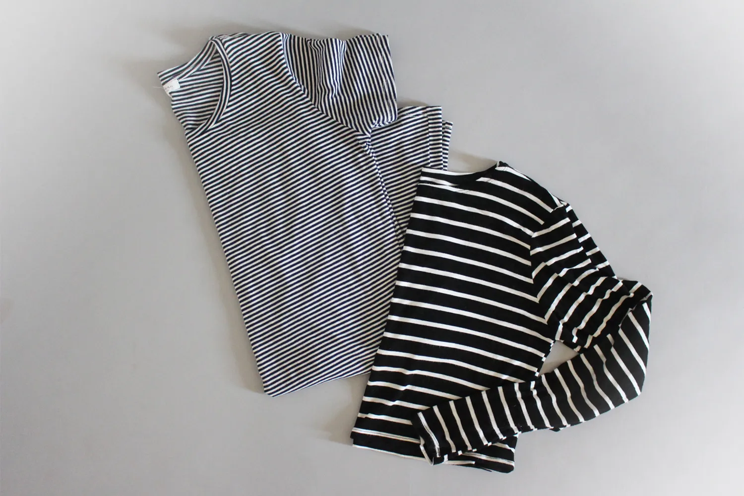 Travel outfit with striped tee, flares, and hat