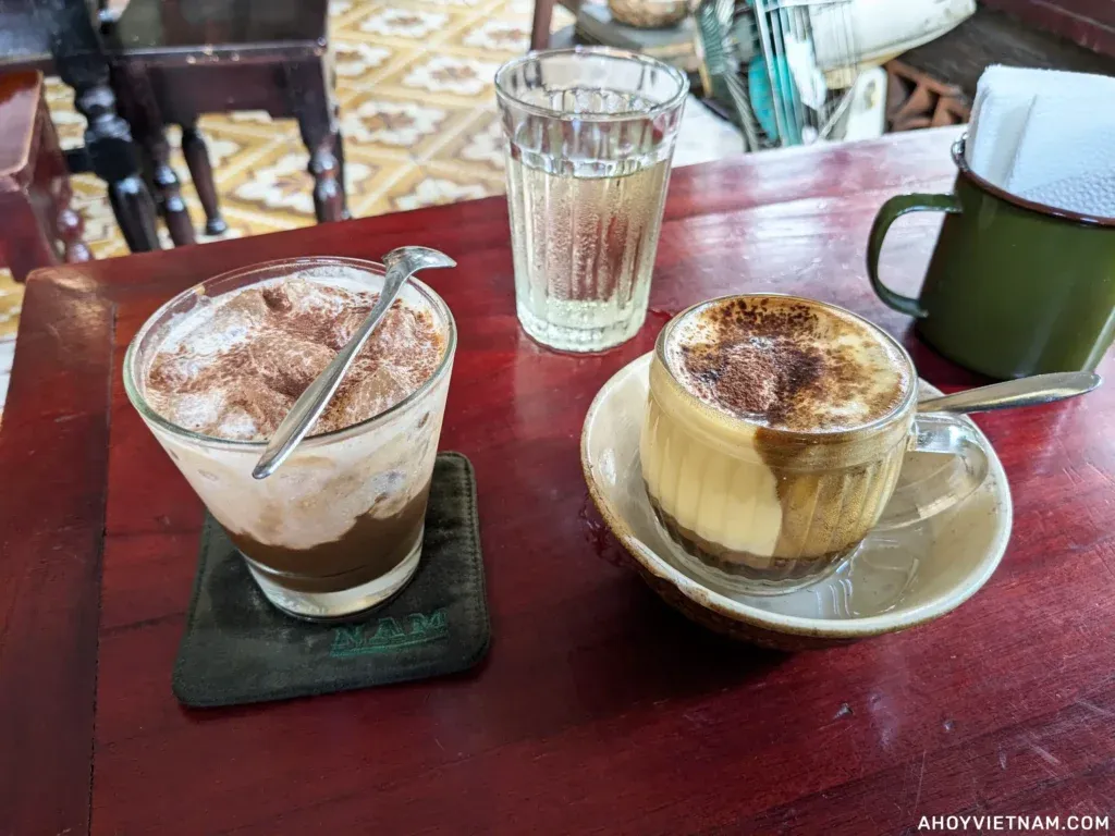 Two cups of specialty coffee on a table at a cafe in Da Nang, Vietnam, a must-see experience.