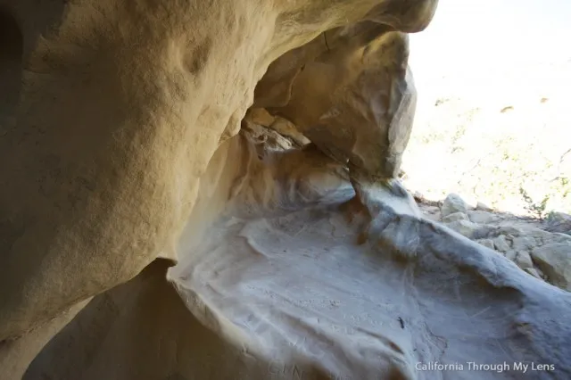 Unique rock formations with cave openings shaped by wind