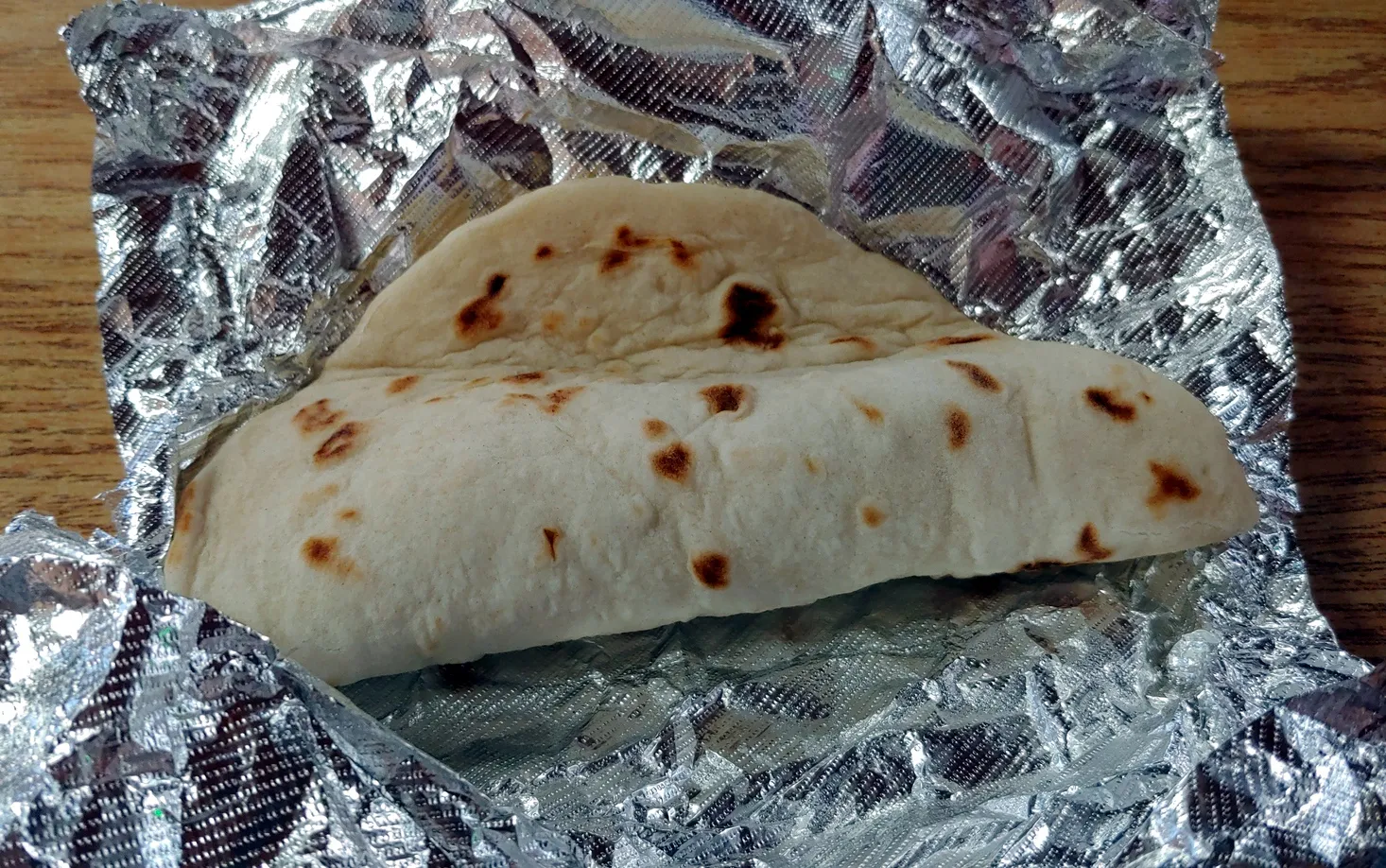 Unwrapped Chorizo and Egg taco from the Original Donut Shop, showing the filling
