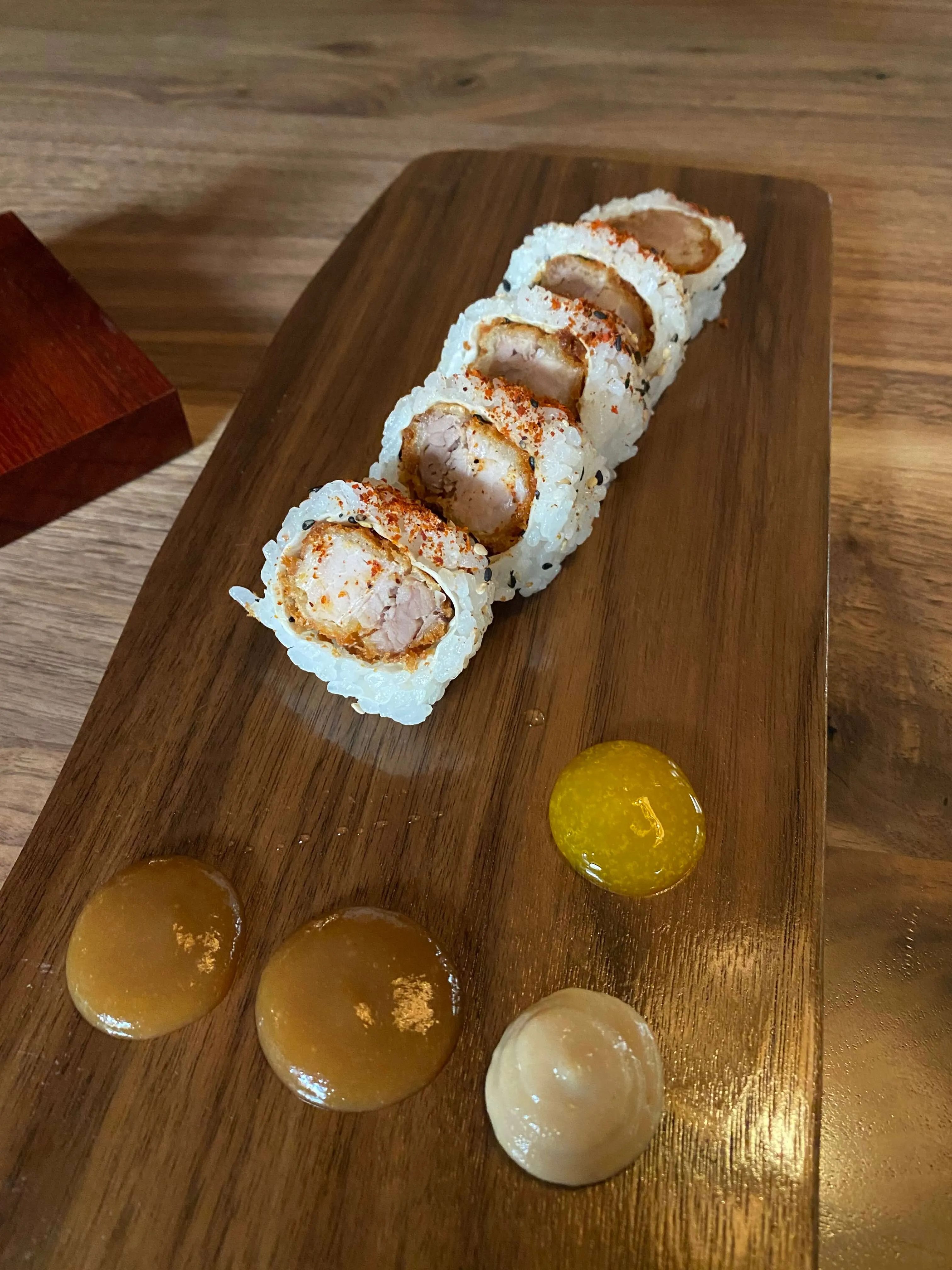 Various creative dishes and sushi served at Uchi Austin during their happy hour