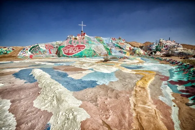 Vibrant, colorful painted mountain structure in the desert