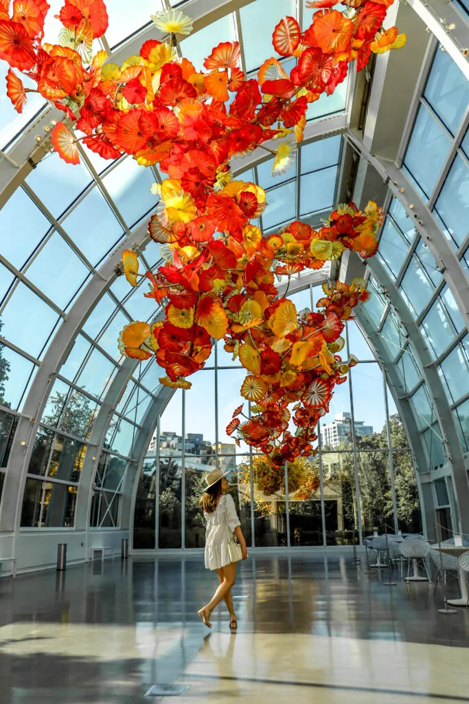 Vibrant red and orange glass sculpture inside the Chihuly Garden and Glass museum in Seattle