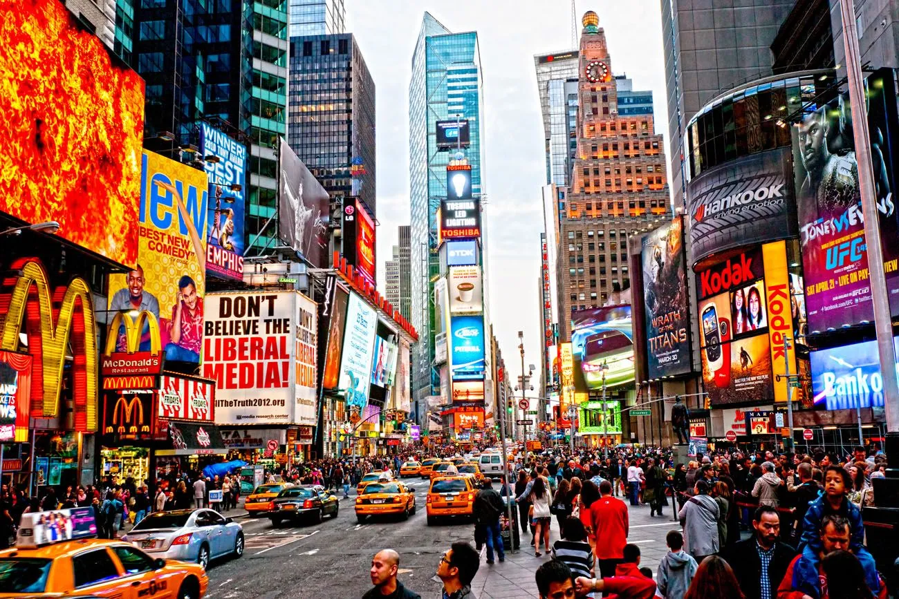 Vibrant Times Square with large digital billboards at night
