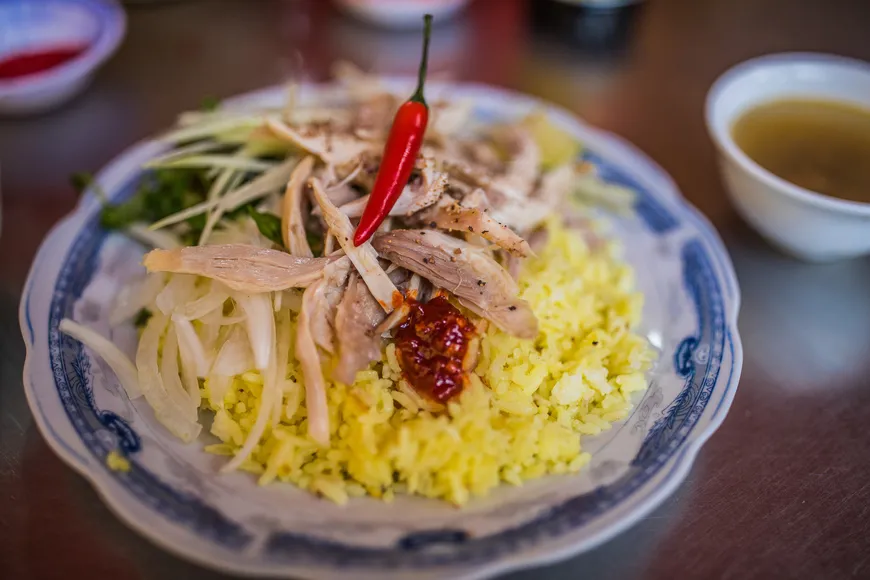 Vietnamese Com Ga, chicken rice with herbs and pickled vegetables