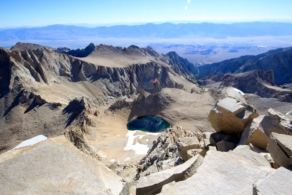View from the barren, rocky summit of Mount Whitney, the highest peak in the contiguous United States