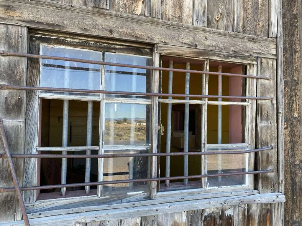 View of railway tracks near abandoned buildings in Litchfield, California