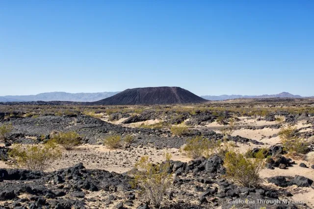 View of the Amboy Crater cinder cone volcano in the desert