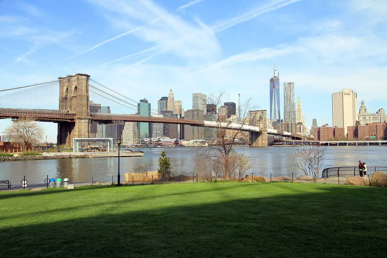 View of the Brooklyn Bridge from Brooklyn Bridge Park with Manhattan skyline in background