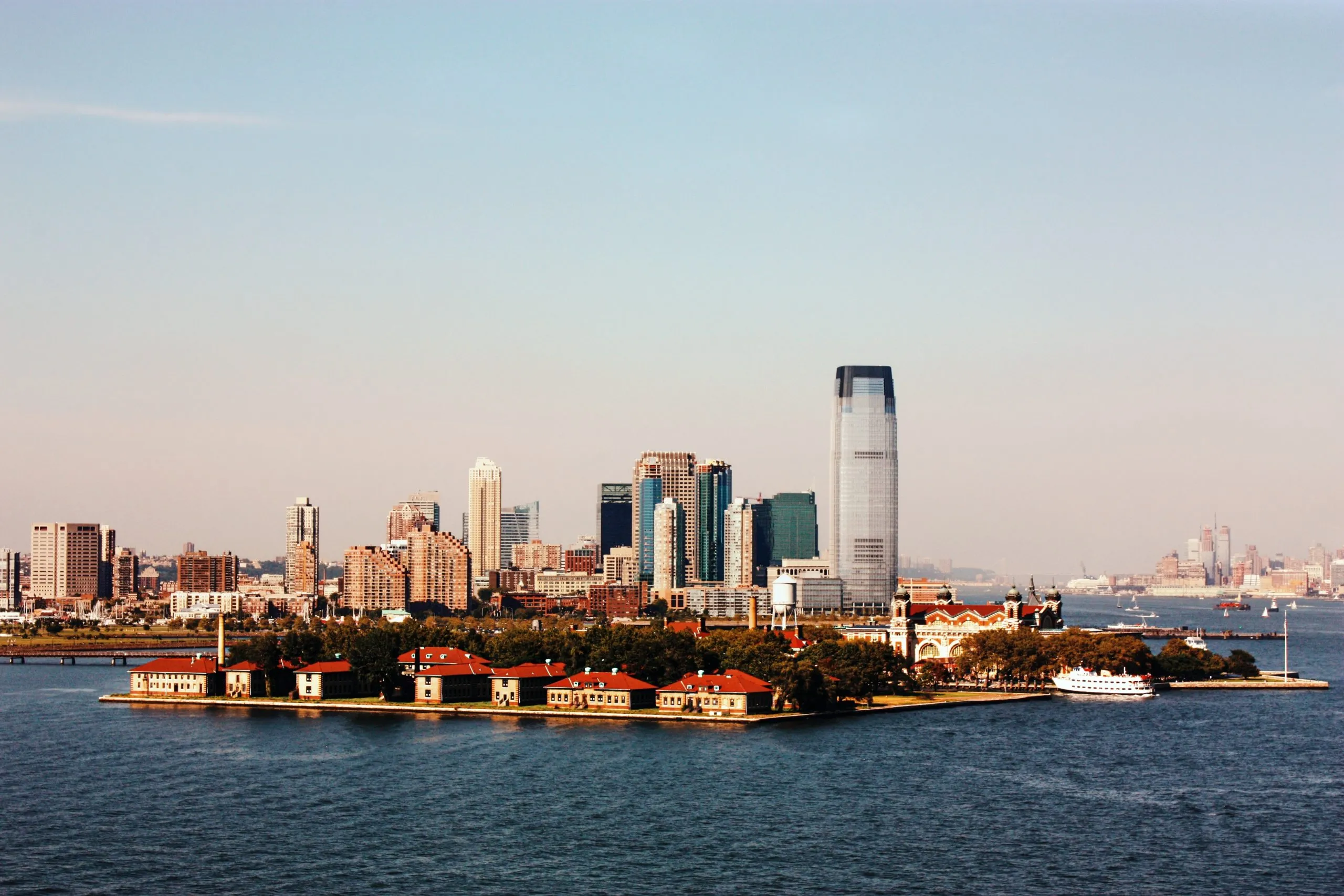 View of the Manhattan skyline from Ellis Island on a sunny day