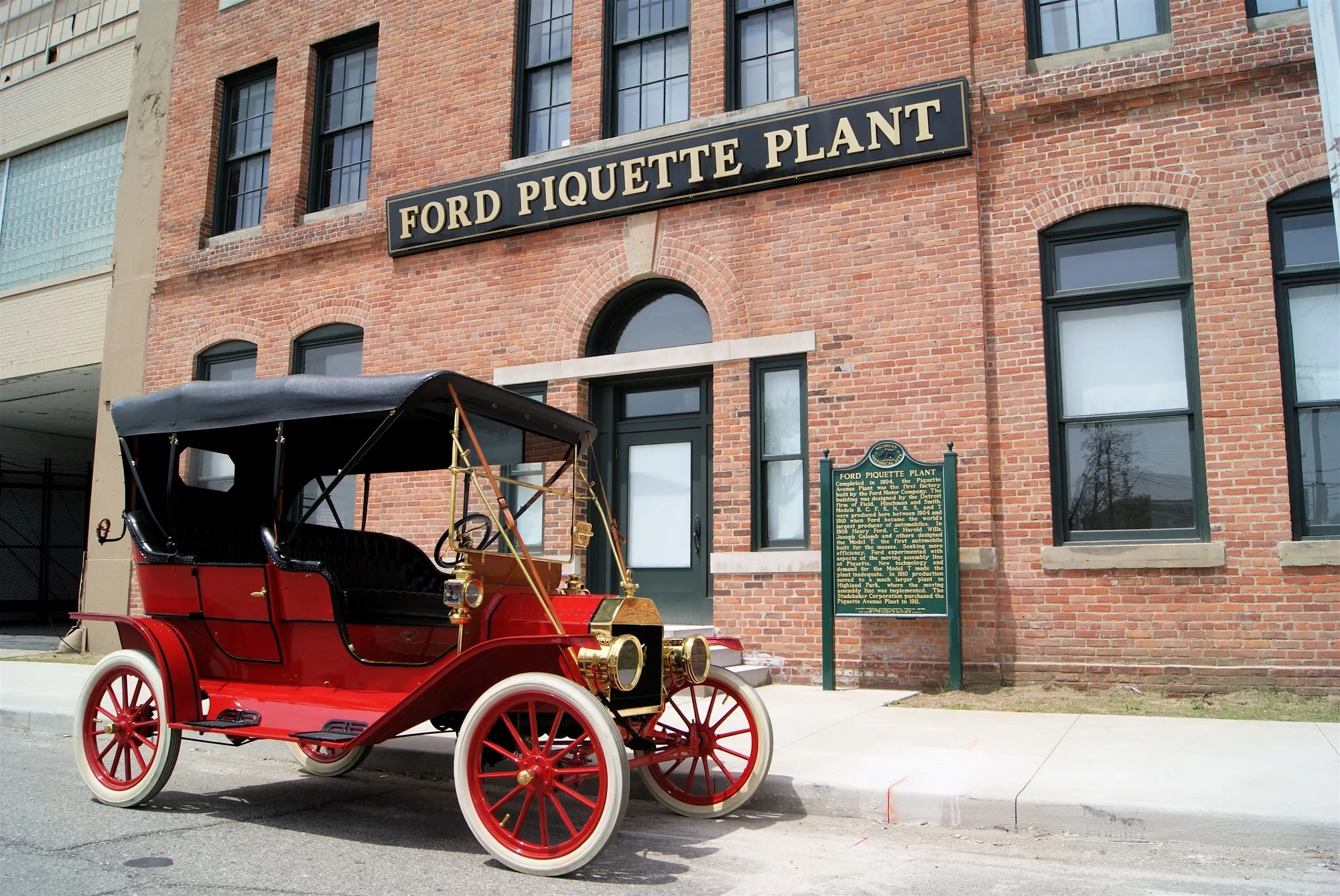 Vintage Ford Model T parked outside the historic Ford Piquette Avenue Plant in Detroit