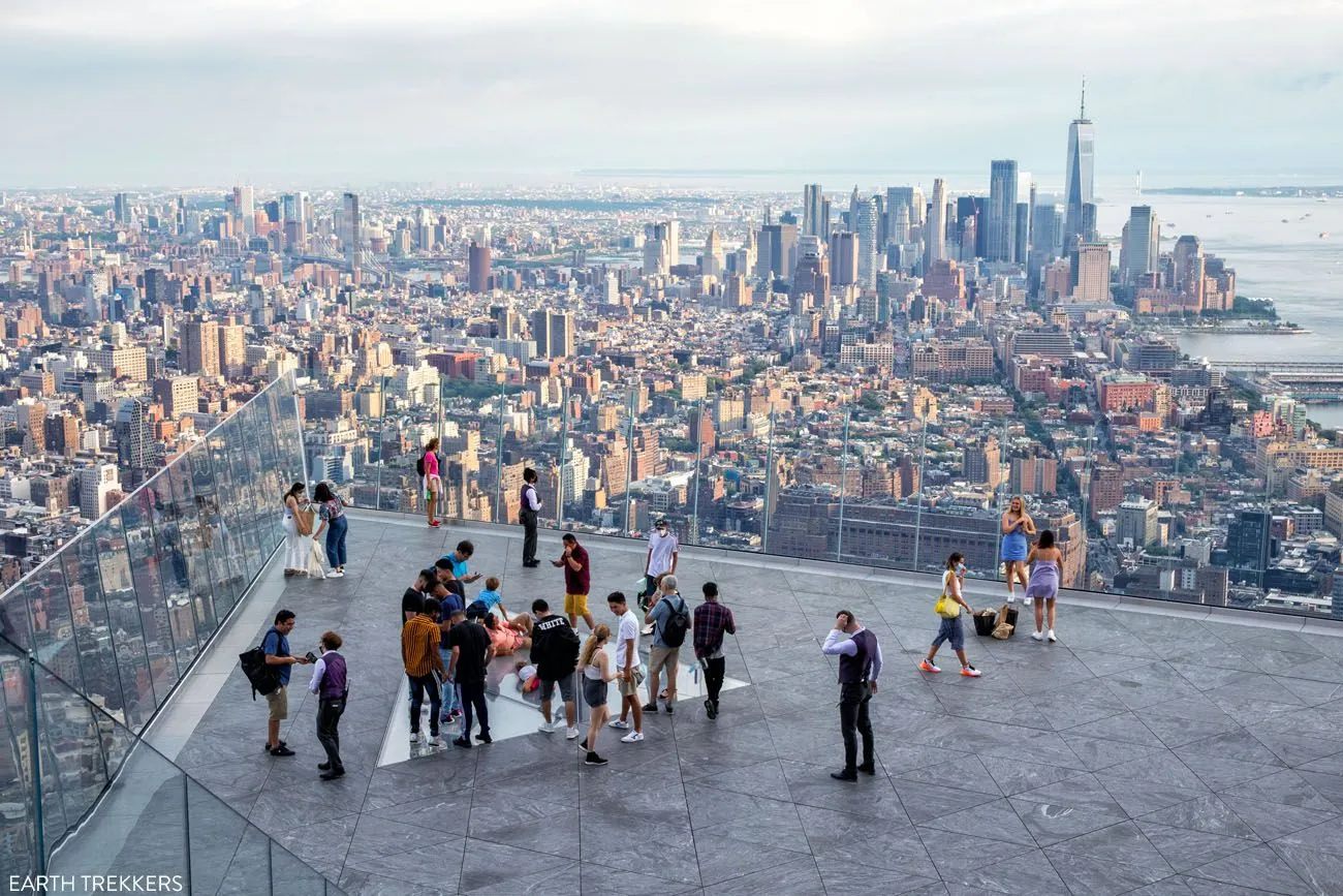 Visitors standing on the outdoor platform of The Edge observation deck