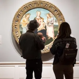 Visitors viewing a classical painting at the Portland Art Museum, an engaging cultural activity among fun things to do in Oregon
