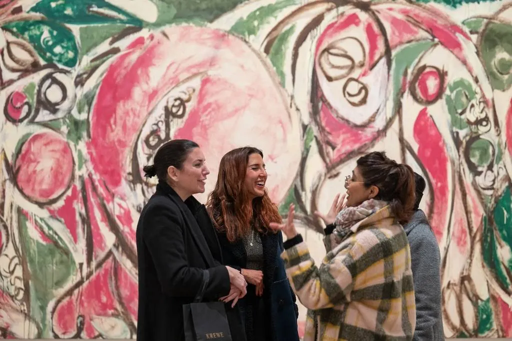 Visitors viewing an exhibition inside The Whitney Museum