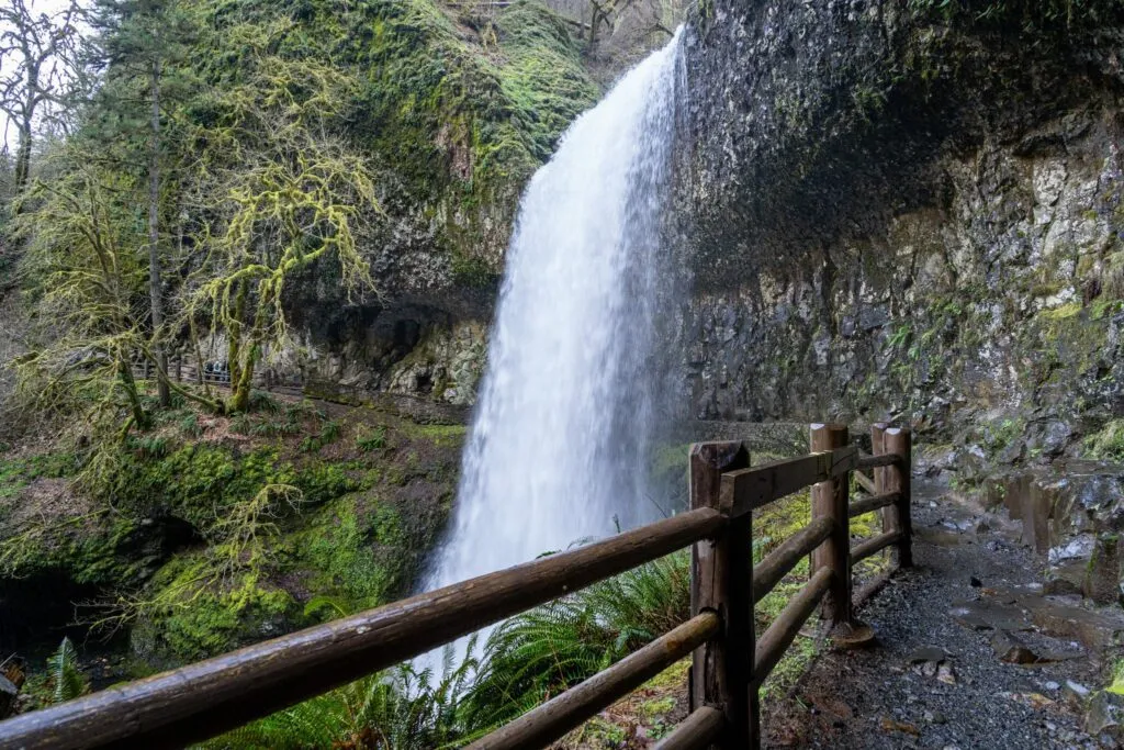 Walking behind Lower South Falls on the iconic Trail of Ten Falls in Oregon