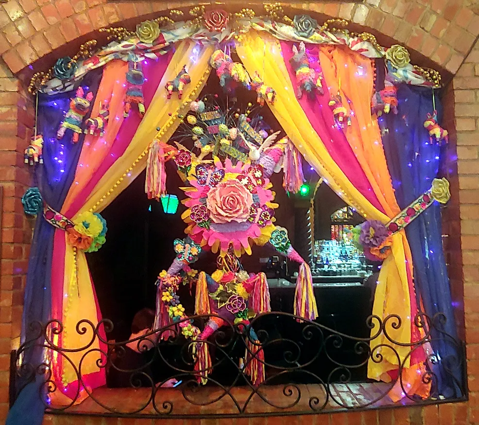 Window decorations inside Mi Tierra, adding to the festive atmosphere while dining on what to eat in san antonio texas