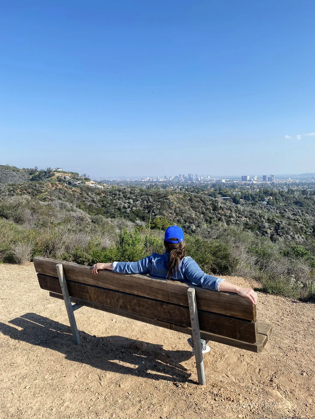Unlock Culinary Secrets - Finding Exceptional Private Cooking Classes Los Angeles woman enjoying views of LA from Inspiration Point, must visit during your 4 day Los Angeles itinerary