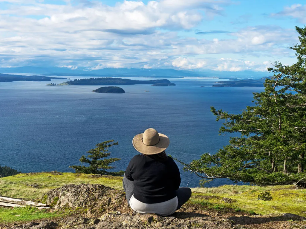 Woman looking out at the Samish Sea from a viewpoint on Orcas Island